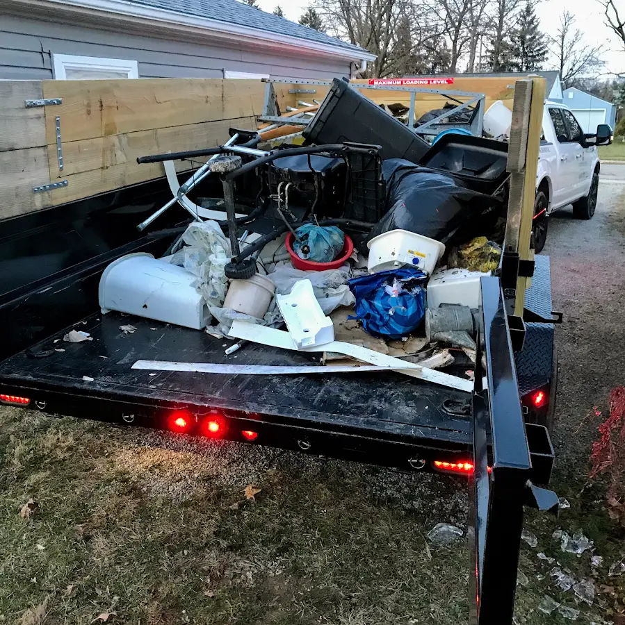Roll-off dumpster delivered to a residential driveway in Lake Land'Or